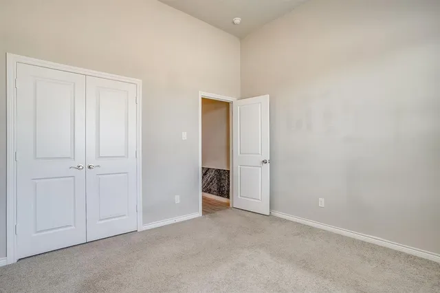 a view of an empty room and entryway