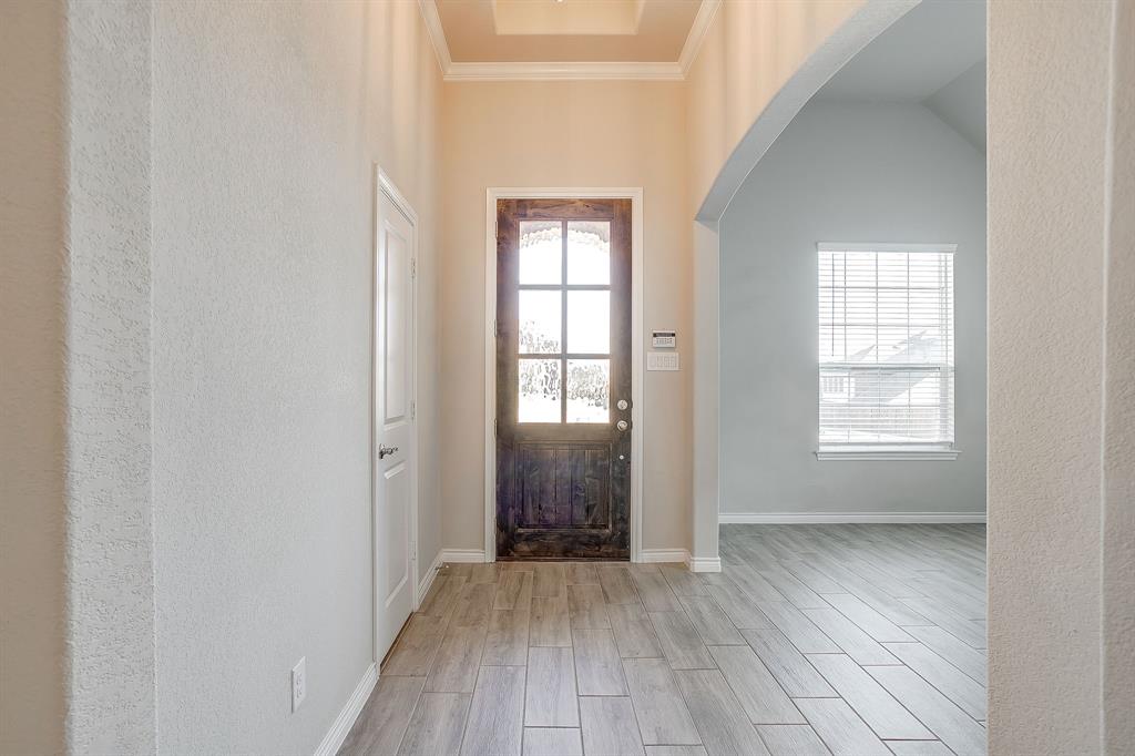 1281 Palo Duro Court Burleson, TX 76028 - Photo 4 of 39 an empty room with wooden floor and windows