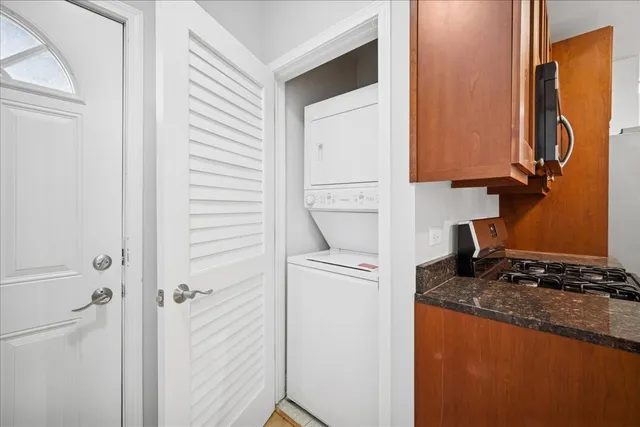 a kitchen with a refrigerator and a stove