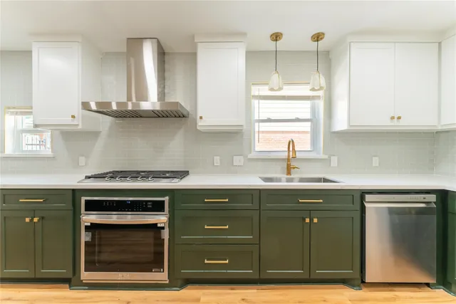 a kitchen with a sink and cabinets