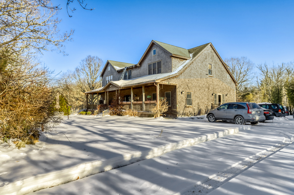 24 Cournoyer Road West Tisbury, MA 02568 - Photo 11 of 11 a view of a house with a patio