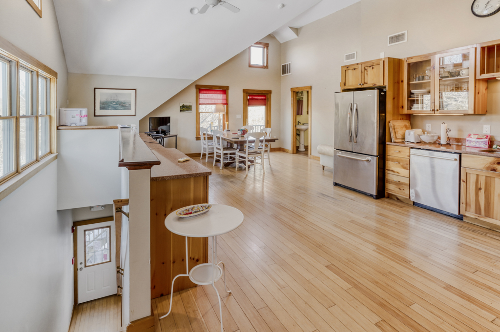 24 Cournoyer Road West Tisbury, MA 02568 - Photo 5 of 11 a kitchen with stainless steel appliances granite countertop a refrigerator and a stove top oven