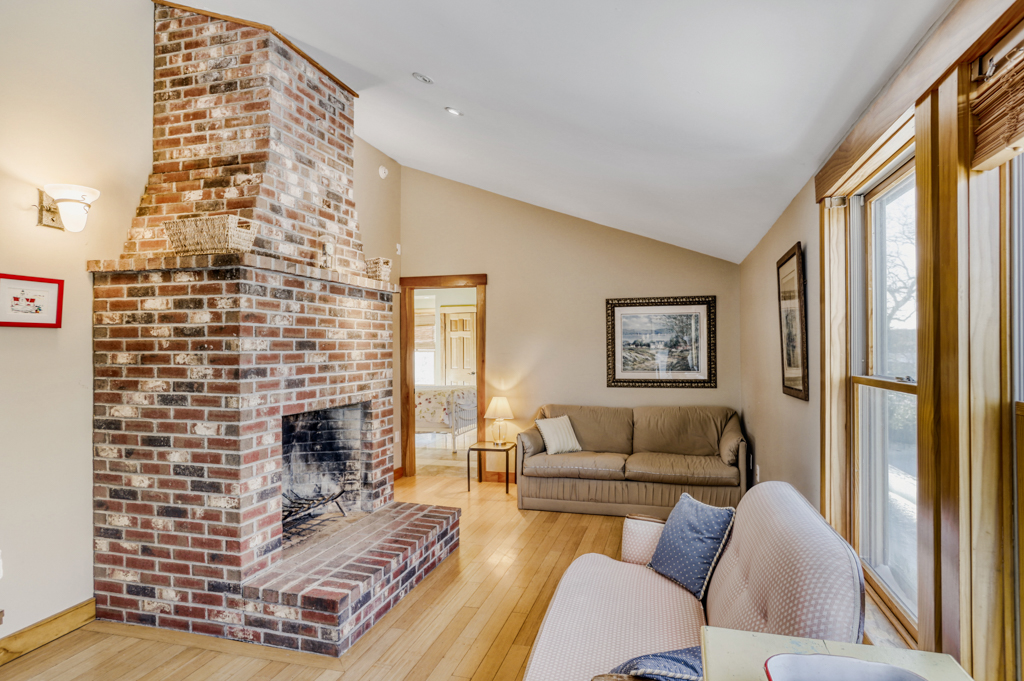 24 Cournoyer Road West Tisbury, MA 02568 - Photo 8 of 11 a living room with furniture and a fireplace
