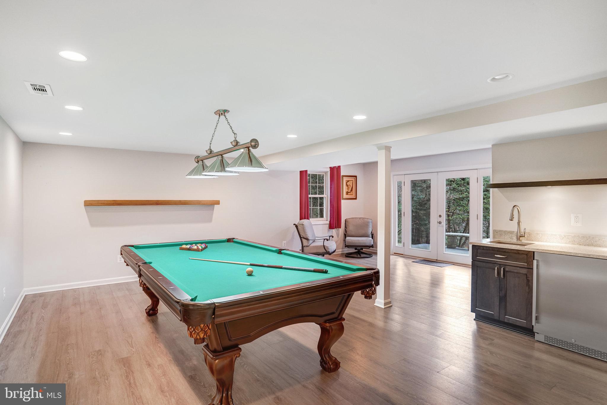 10708 Midsummer Drive Reston, VA 20191 - Photo 26 of 41 Lower level recreation room