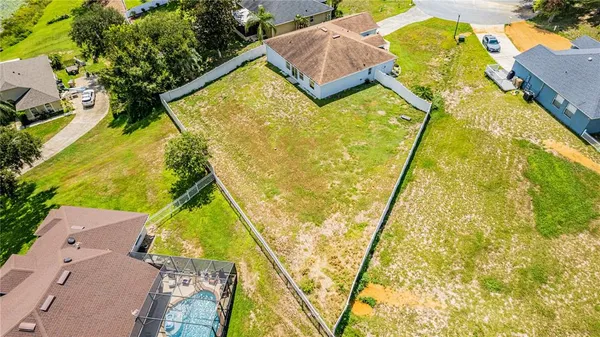 an aerial view of residential house with swimming pool