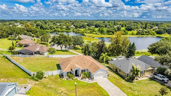 a view of a swimming pool with a yard