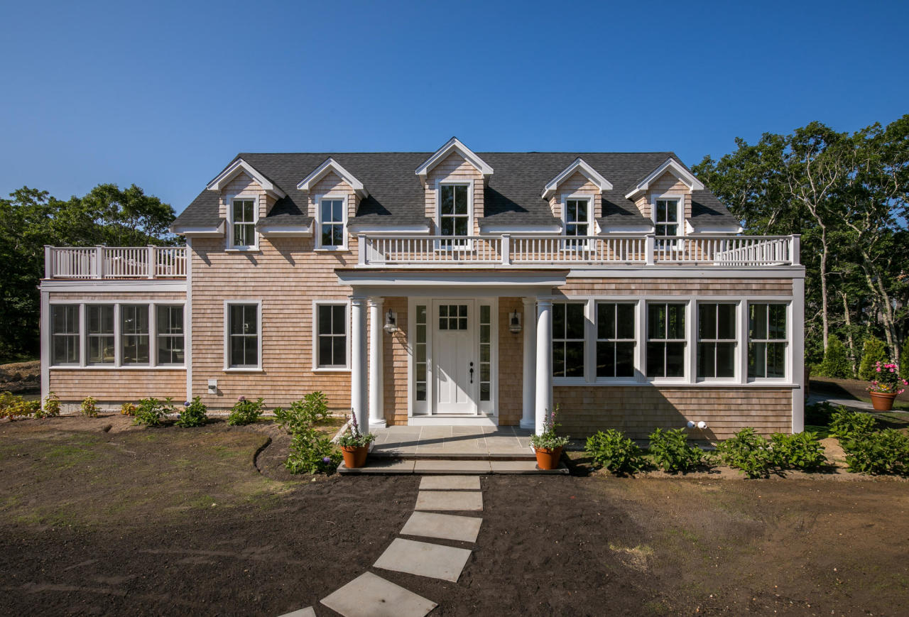 front view of a house with a yard