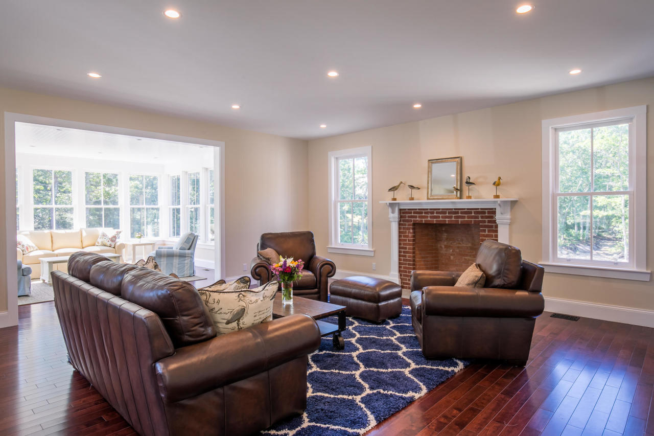 28 Fishermans Knot Road Edgartown, MA 02539 - Photo 11 of 30 a living room with furniture and a fireplace