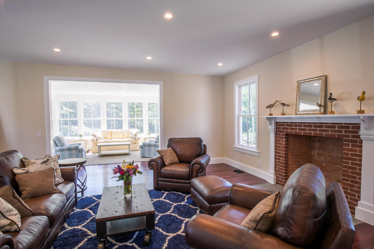 28 Fishermans Knot Road Edgartown, MA 02539 - Photo 12 of 30 a living room with furniture or fireplace and a floor to ceiling window