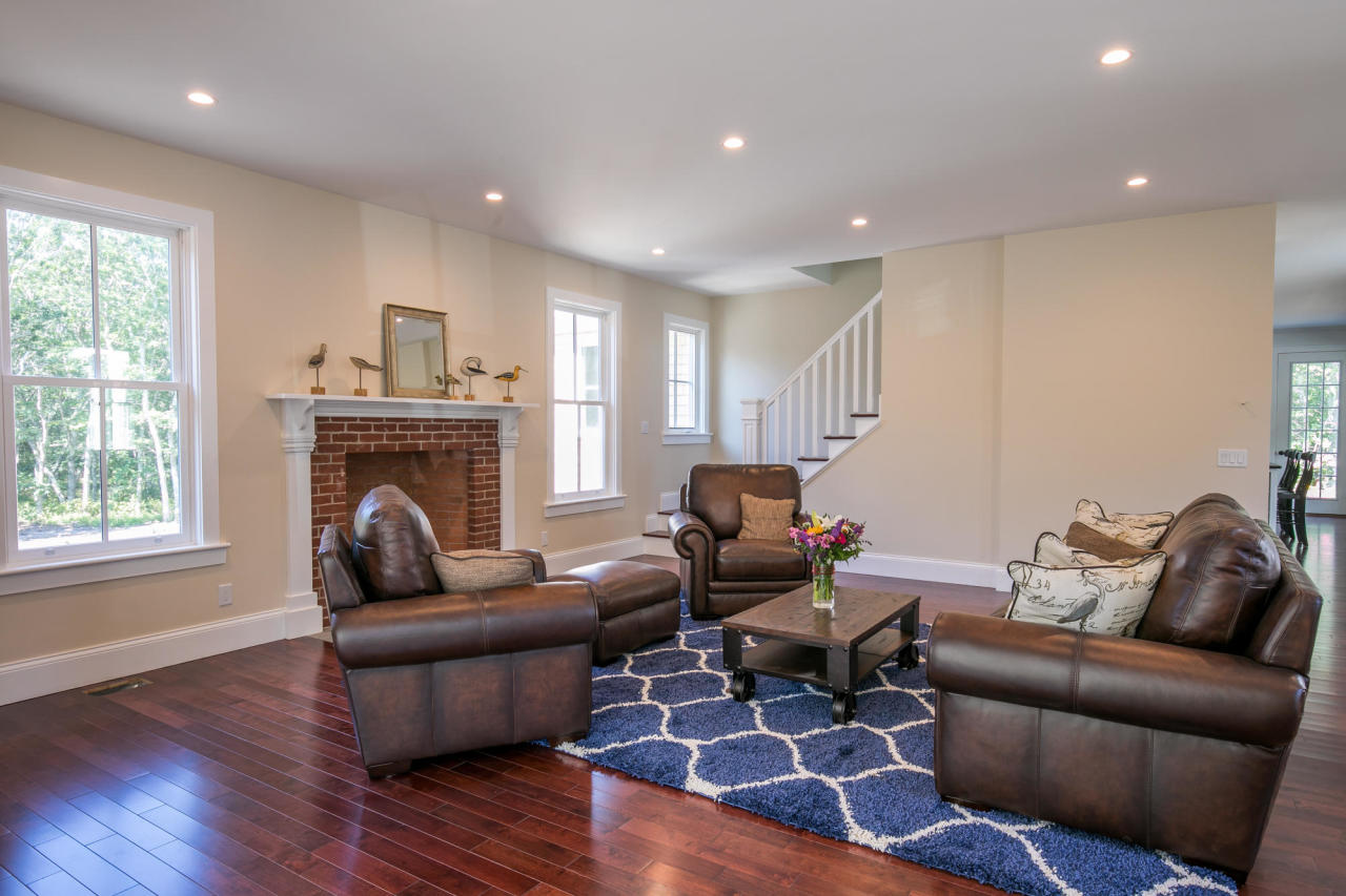 28 Fishermans Knot Road Edgartown, MA 02539 - Photo 13 of 30 a living room with furniture and a fireplace