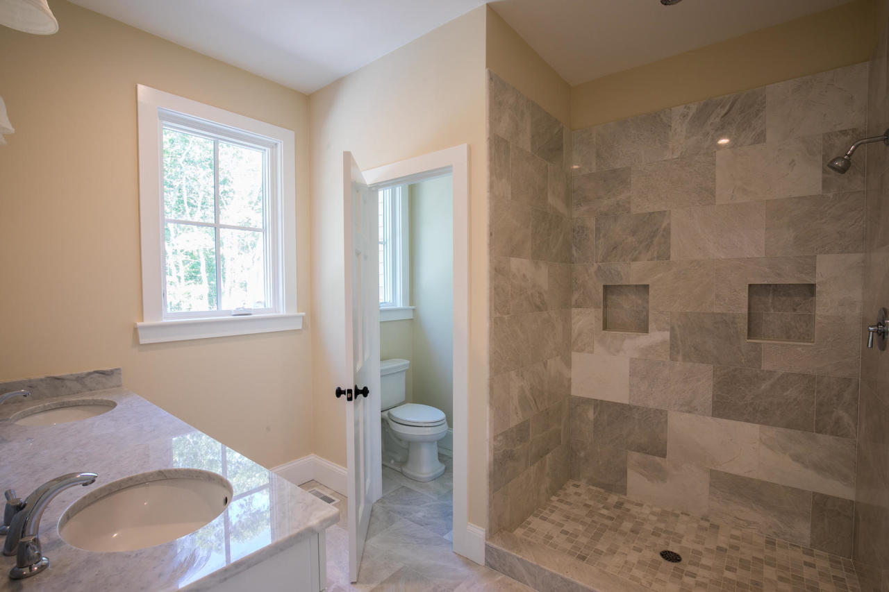 28 Fishermans Knot Road Edgartown, MA 02539 - Photo 16 of 30 a bathroom with a sink toilet and shower