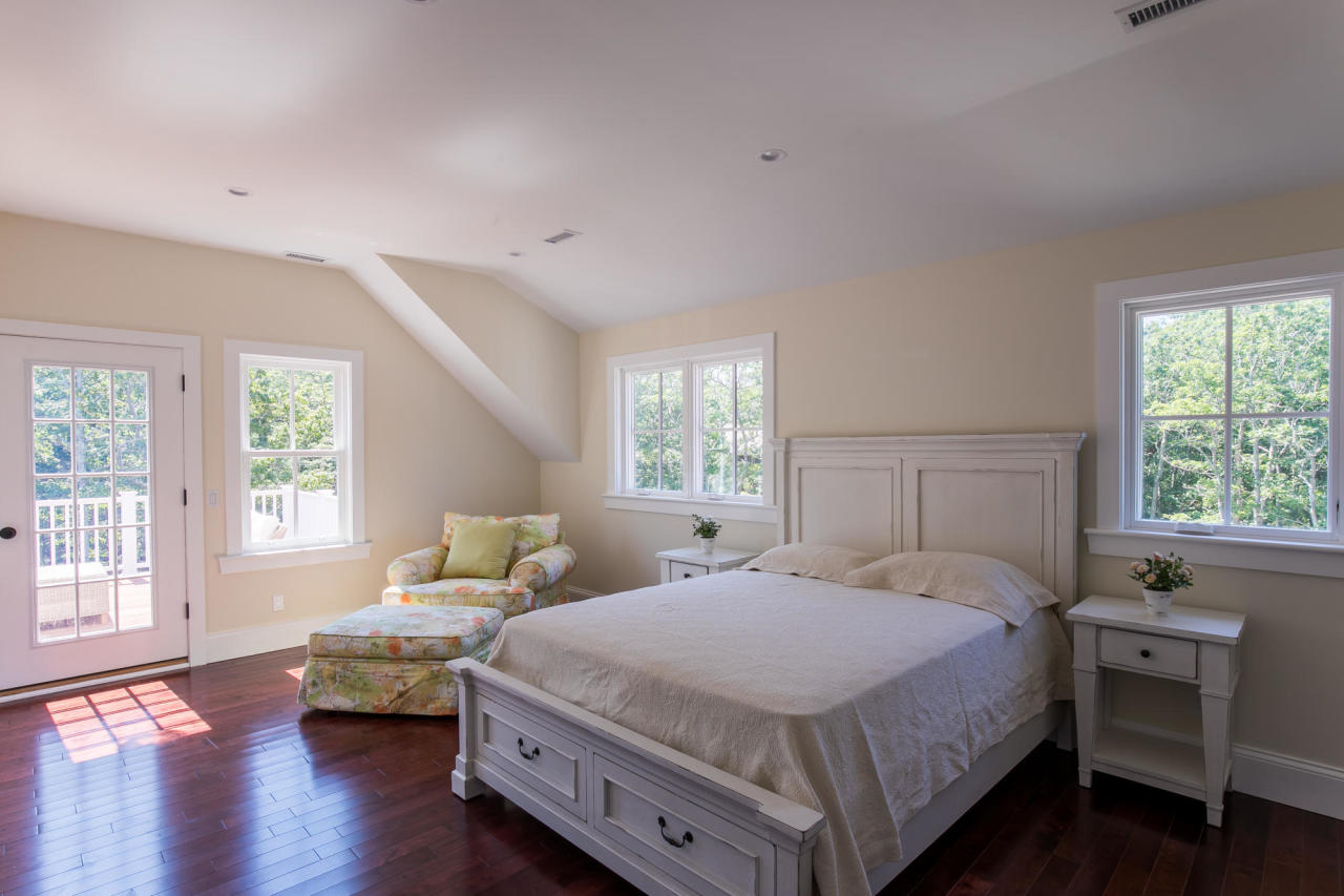 28 Fishermans Knot Road Edgartown, MA 02539 - Photo 17 of 30 a bedroom with a bed and wooden floor