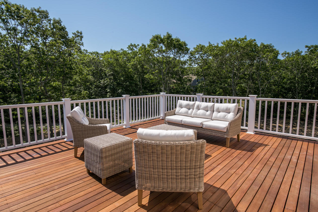 28 Fishermans Knot Road Edgartown, MA 02539 - Photo 18 of 30 a roof deck with couches and wooden floor