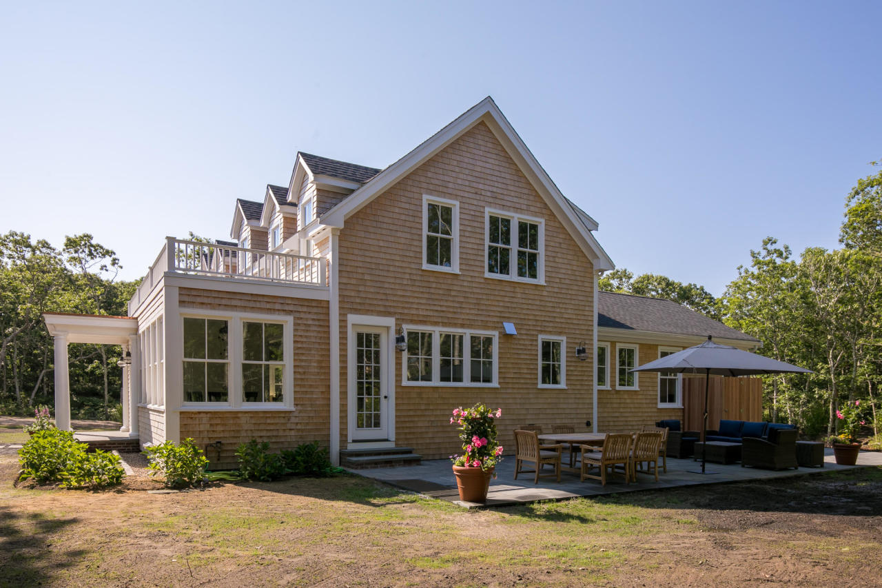 28 Fishermans Knot Road Edgartown, MA 02539 - Photo 22 of 30 a front view of a house with yard and trees