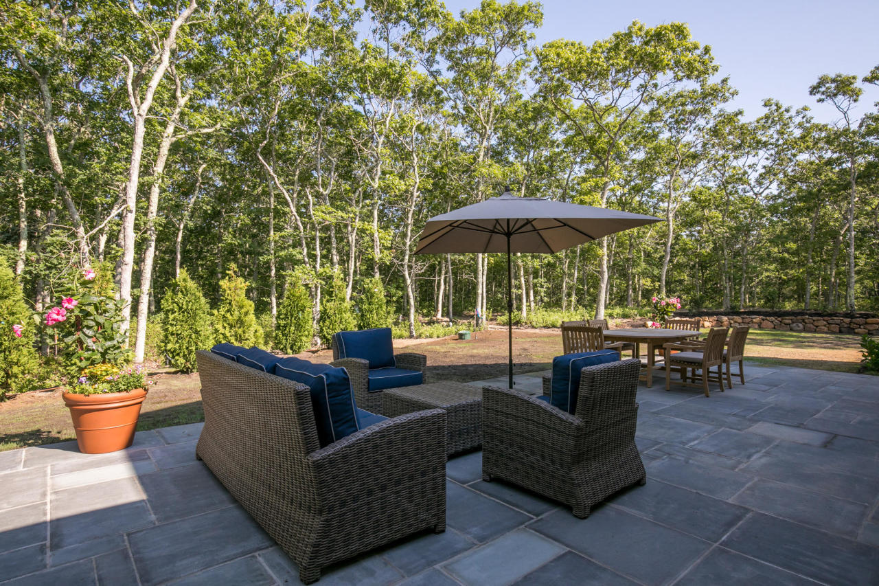 28 Fishermans Knot Road Edgartown, MA 02539 - Photo 23 of 30 a view of a patio with couches and potted plants