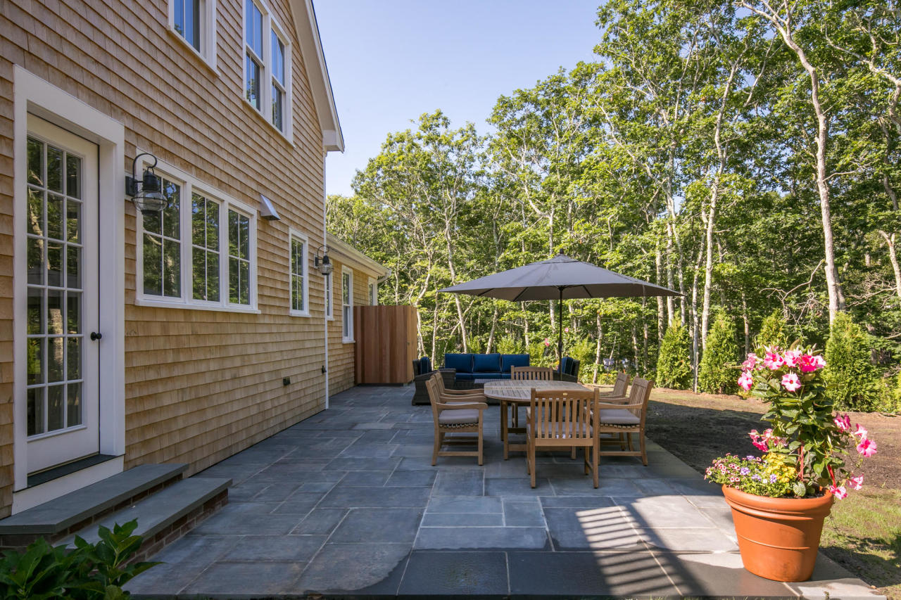 28 Fishermans Knot Road Edgartown, MA 02539 - Photo 25 of 30 a couple of chairs sitting in front of a house