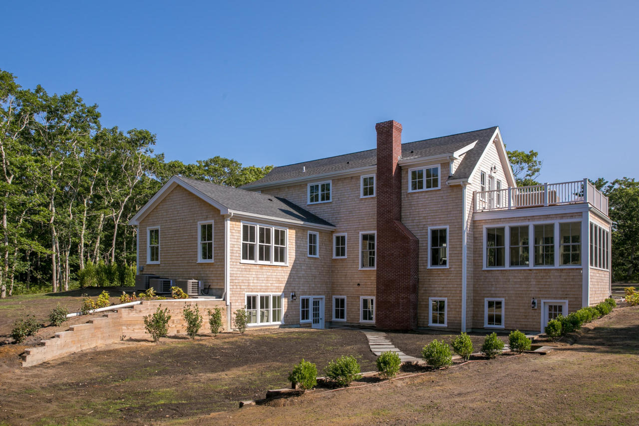 28 Fishermans Knot Road Edgartown, MA 02539 - Photo 28 of 30 a front view of a house with a yard