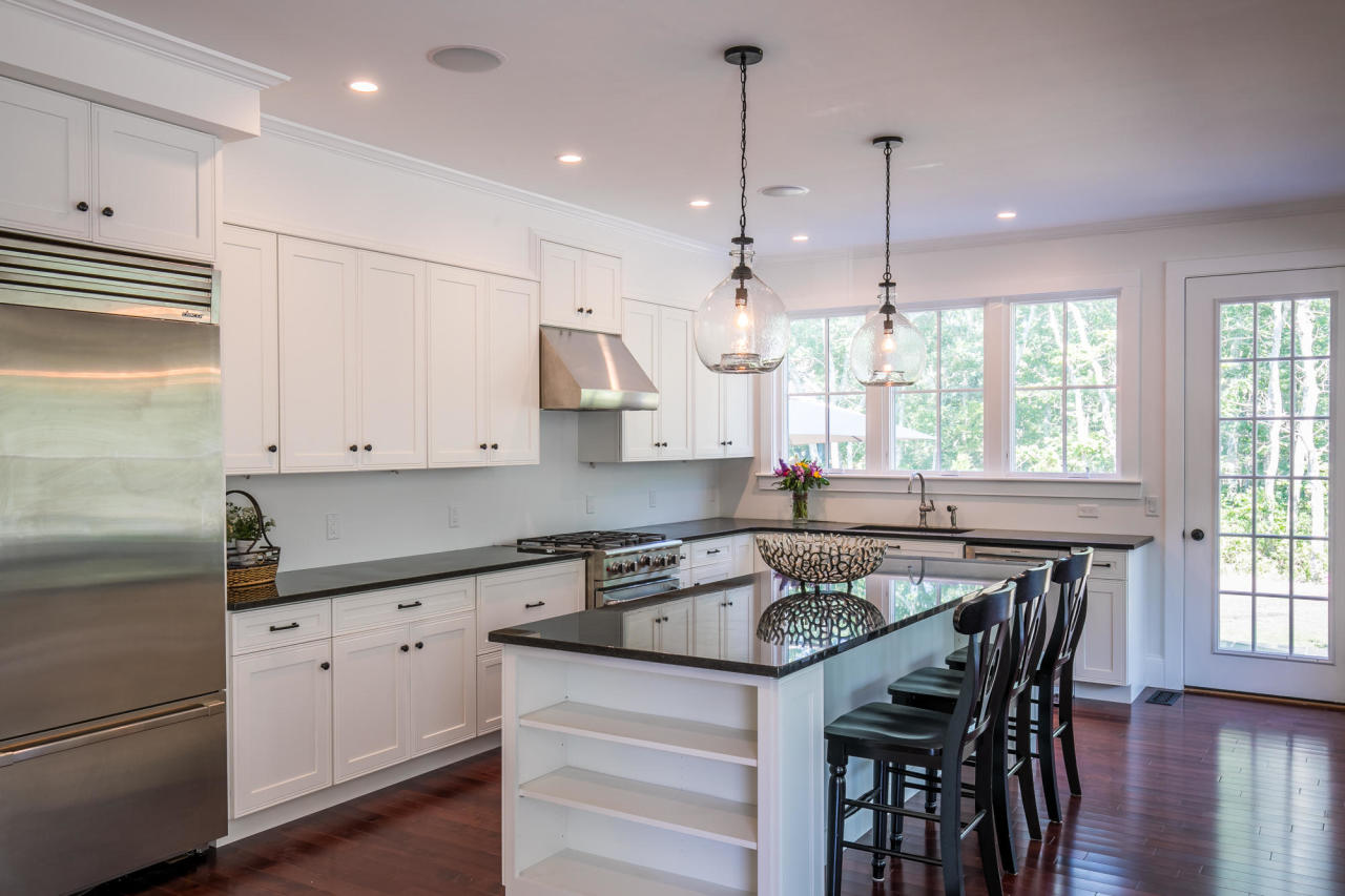 28 Fishermans Knot Road Edgartown, MA 02539 - Photo 6 of 30 a kitchen with granite countertop a sink a center island and stainless steel appliances