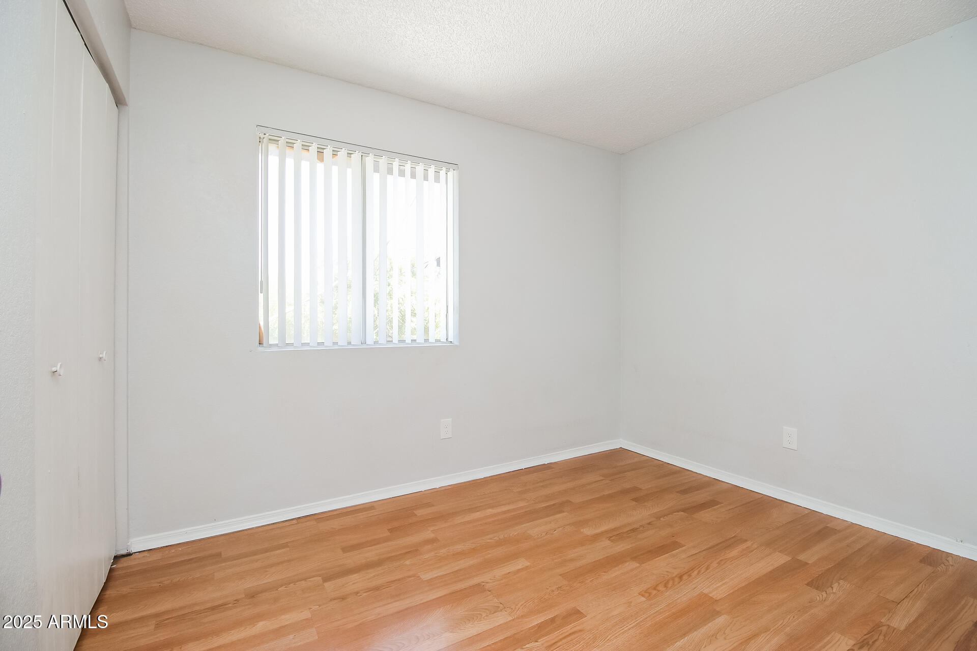1050 West University Drive, Unit 201 Mesa, AZ 85201 - Photo 11 of 15 an empty room with a window