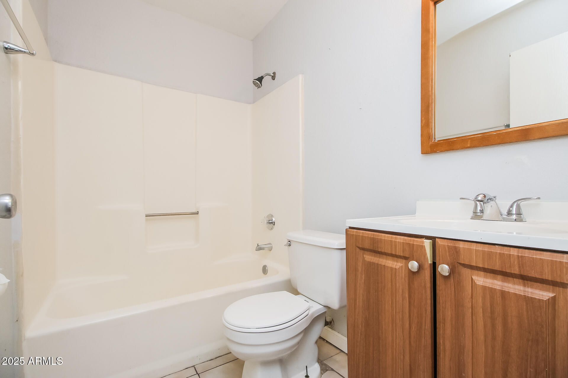 1050 West University Drive, Unit 201 Mesa, AZ 85201 - Photo 14 of 15 a bathroom with a sink a toilet and shower