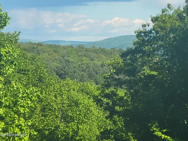 a aerial view of a house with a yard