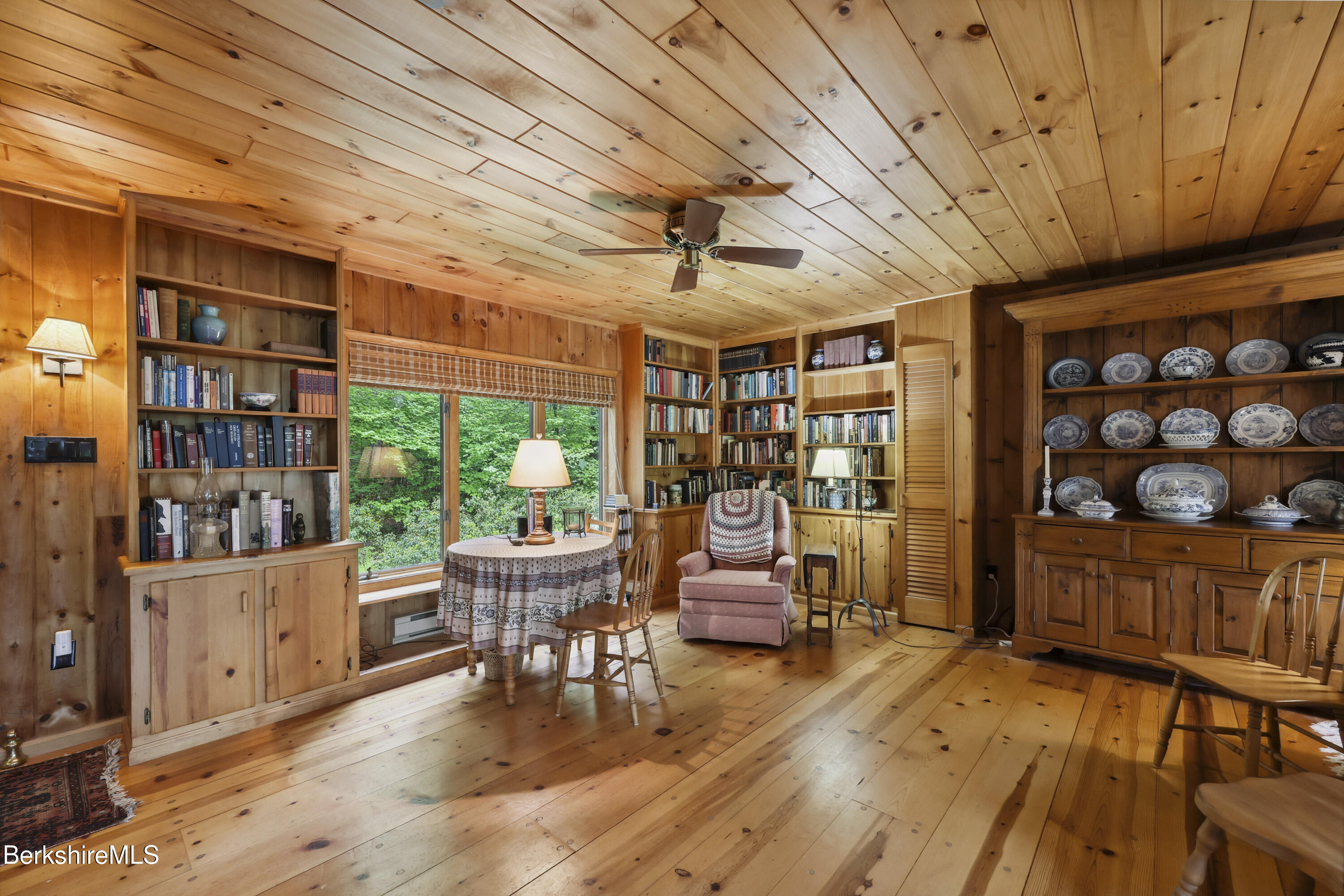 29 Old Village Road Alford, MA 01230 - Photo 12 of 72 a living room with furniture a rug and a bookshelf