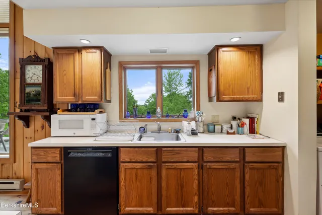 a spacious bedroom with a bed and large windows