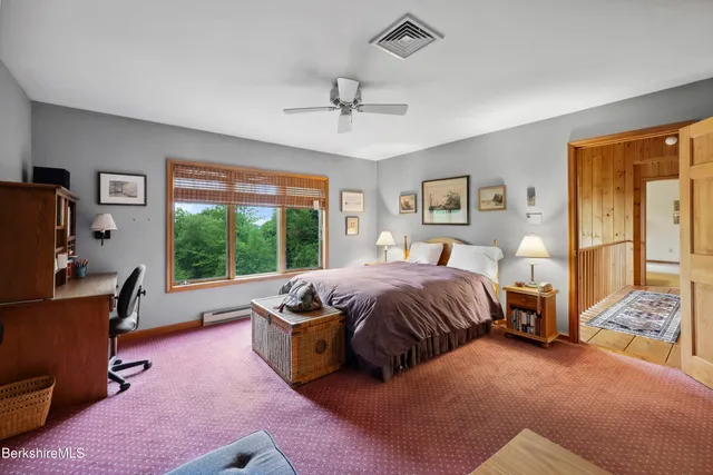 a view of a livingroom with furniture and windows