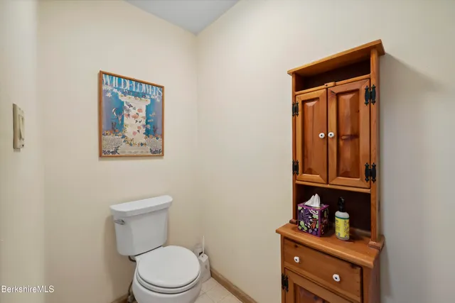 a bedroom with a bed and a table in it