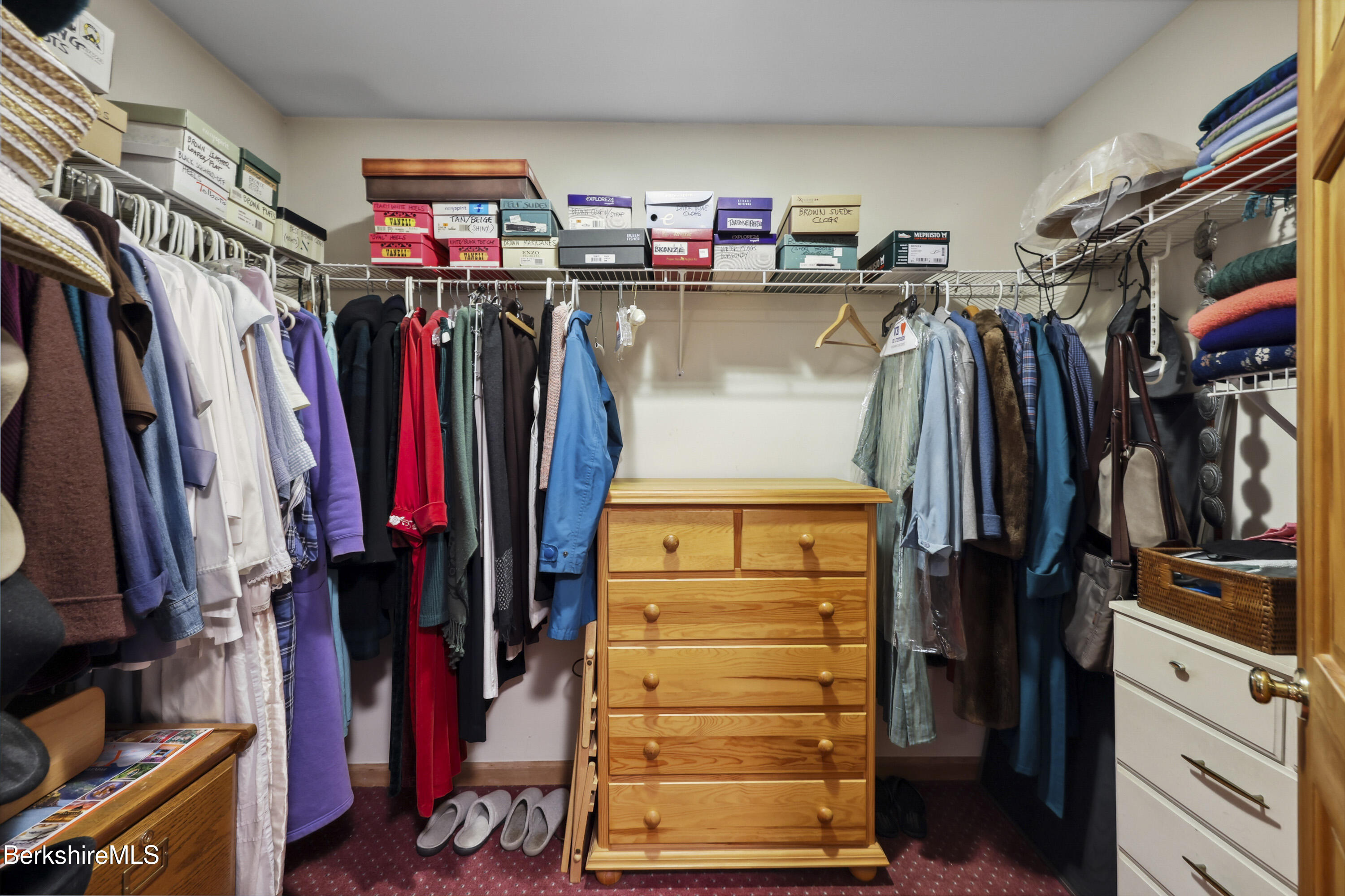 29 Old Village Road Alford, MA 01230 - Photo 31 of 72 a view of walk in closet with clothes and shoes