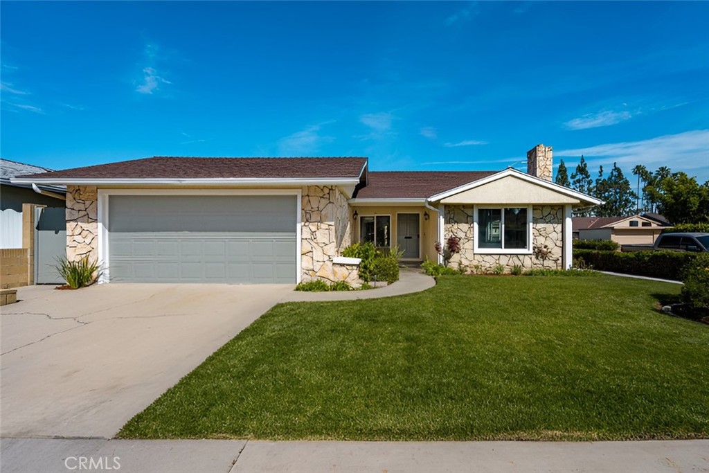 7125 Cole Street Downey, CA 90241 - Photo 1 of 1 a front view of a house with a yard