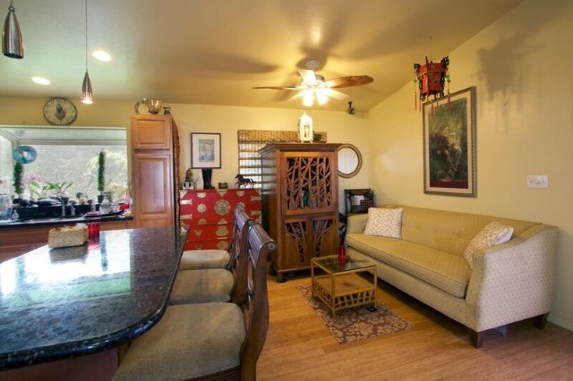 170 Naalae Road Kula, HI 96790 - Photo 8 of 23 a living room with furniture and wooden floor
