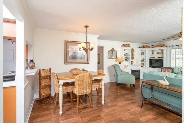 a living room with fireplace furniture and a wooden floor