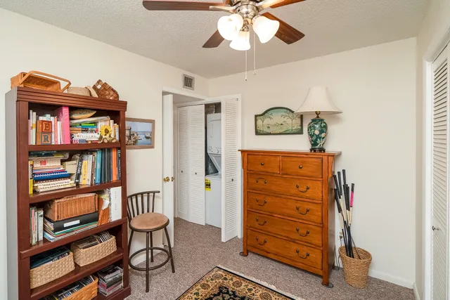 a room with a bed and a chandelier
