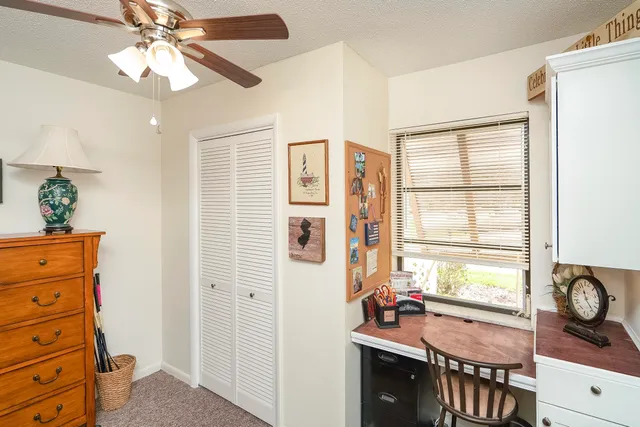 a view of hallway with wooden floor