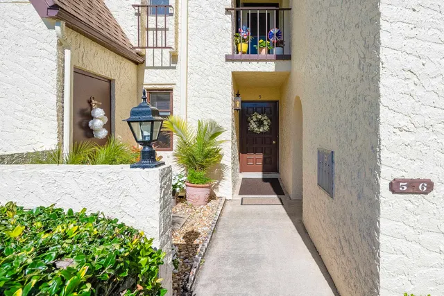 a view of a entryway with flower pots