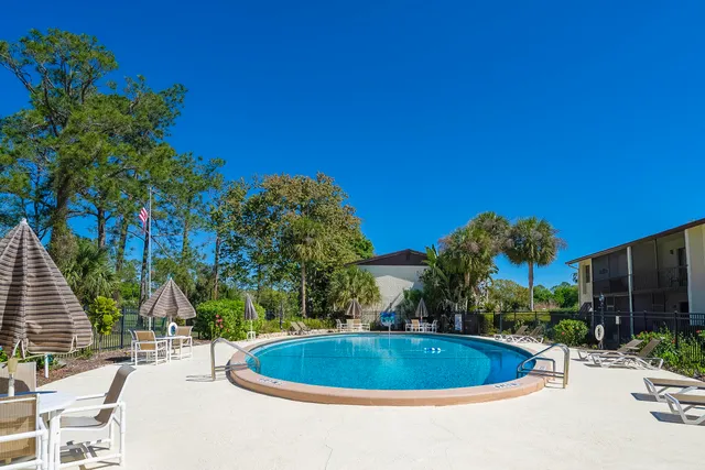 a view of a swimming pool and a yard