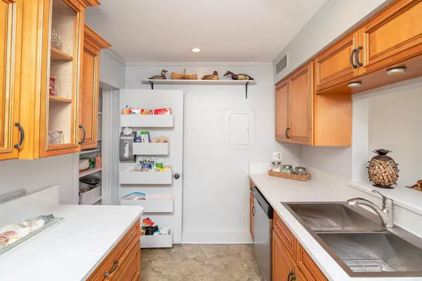 a utility room with lots of clutter and washer