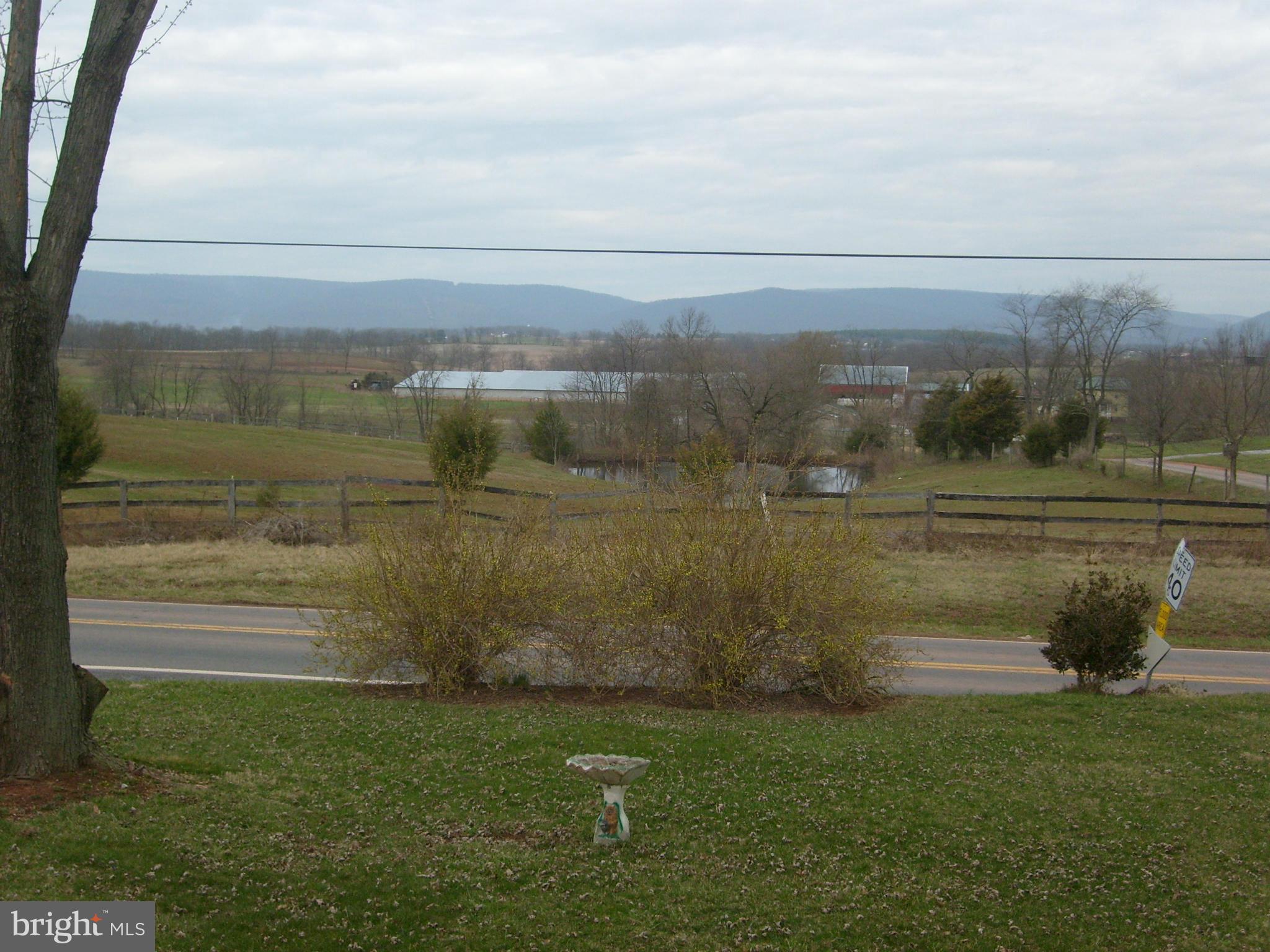 9006 Old Mill Road Rocky Ridge, MD 21778 - Photo 2 of 7 a view of a lake with a mountain