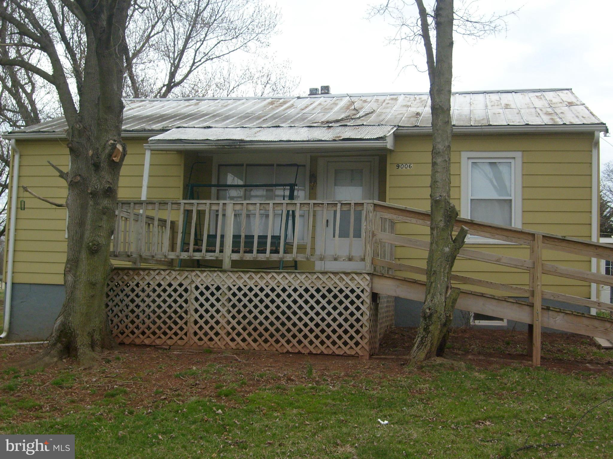 9006 Old Mill Road Rocky Ridge, MD 21778 - Photo 7 of 7 a view of a house with a wooden deck