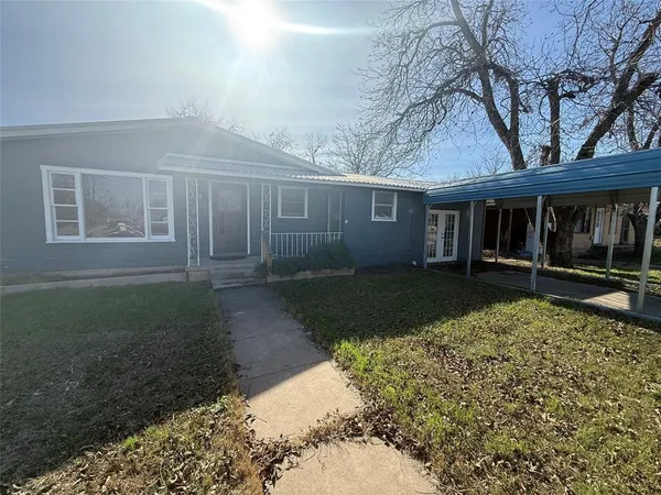 front view of a house with a yard