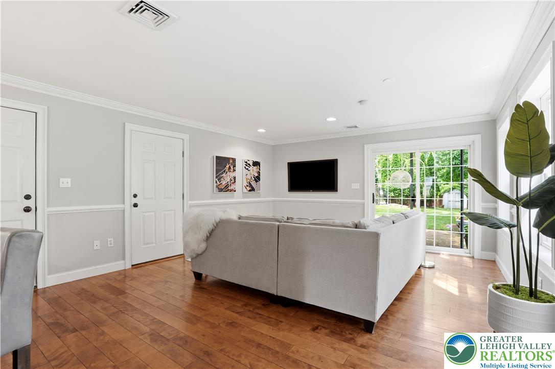 2014 Linden Street Bethlehem, PA 18017 - Photo 28 of 85 Warm hardwood floors and crown molding elevate this inviting living space with abundant natural light.
