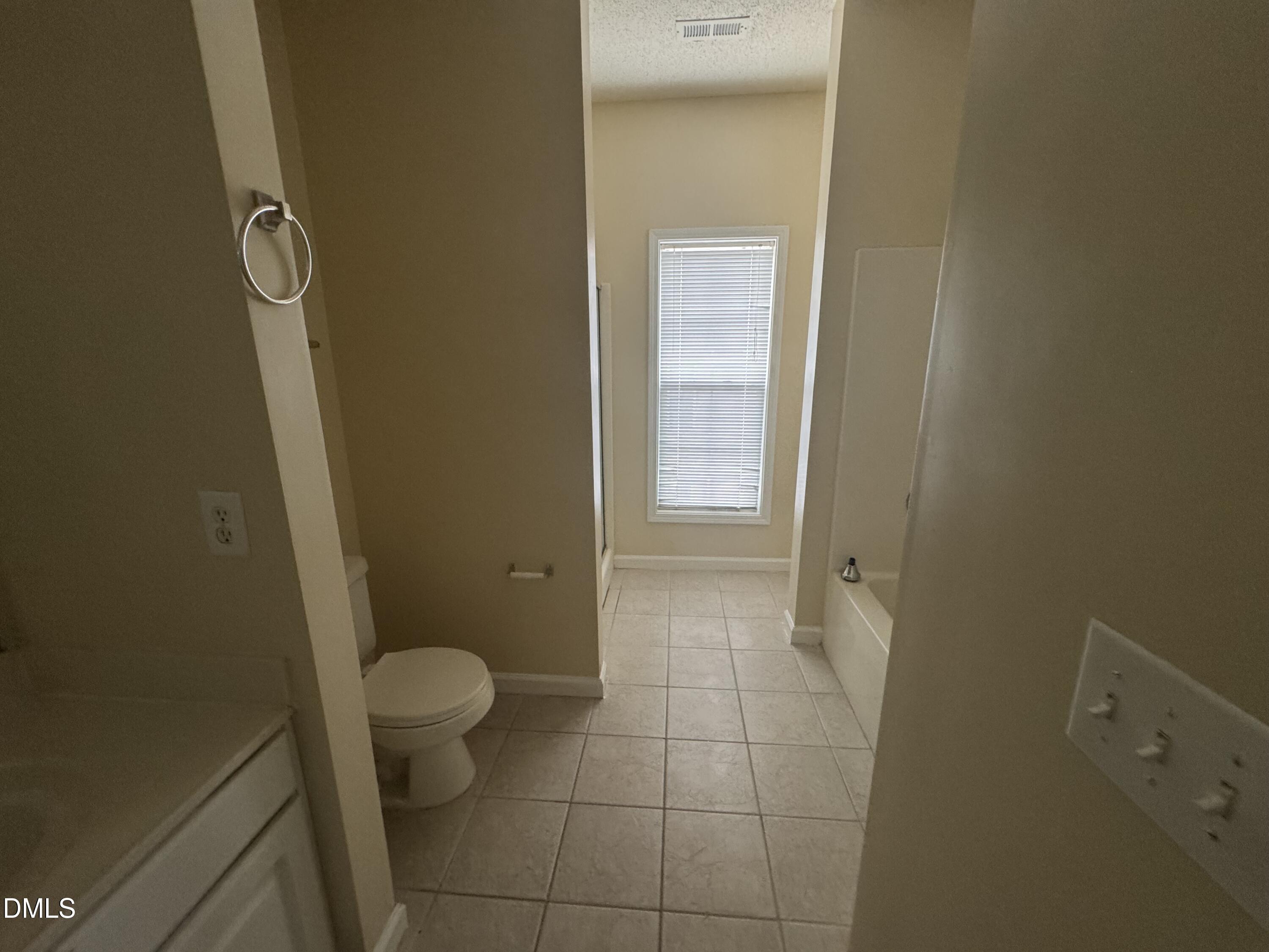 2510 Friedland Place, Unit 202 Raleigh, NC 27617 - Photo 25 of 25 a bathroom with a granite countertop sink and a toilet