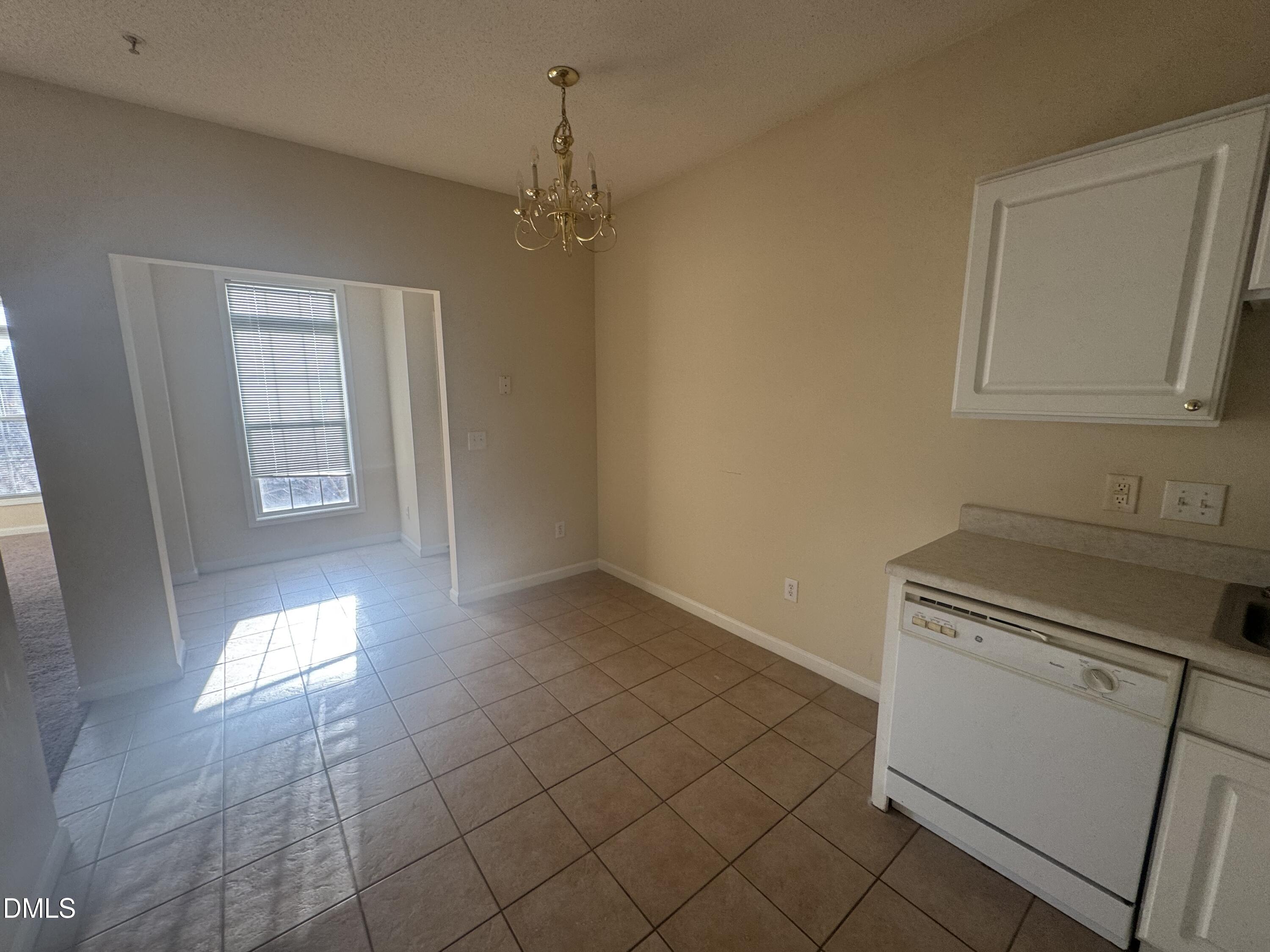 2510 Friedland Place, Unit 202 Raleigh, NC 27617 - Photo 9 of 25 an empty room with windows