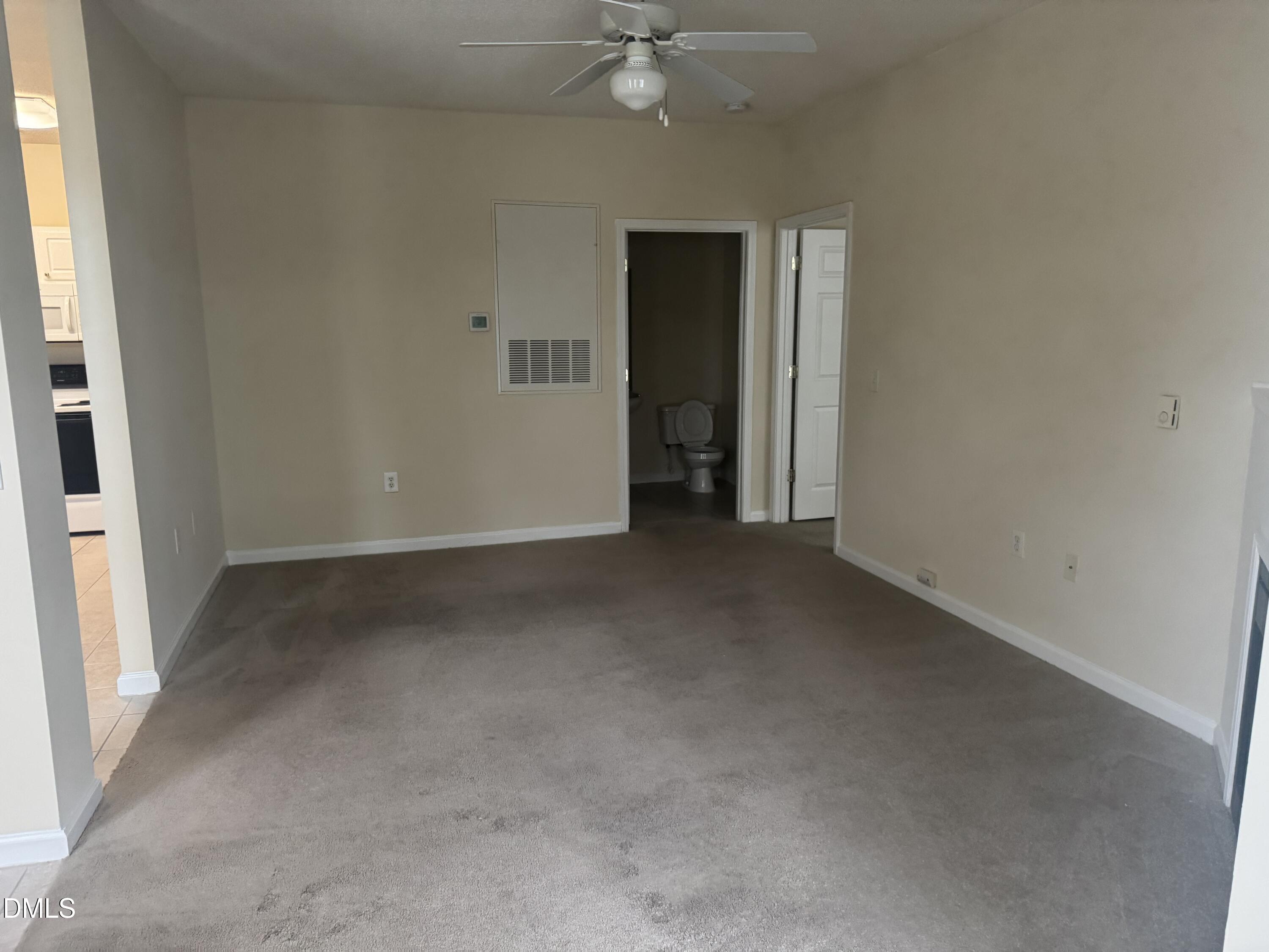 2510 Friedland Place, Unit 202 Raleigh, NC 27617 - Photo 10 of 25 an empty room with closet and a ceiling fan