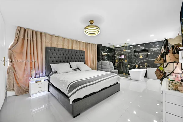 a view of a livingroom with furniture and a flat screen tv