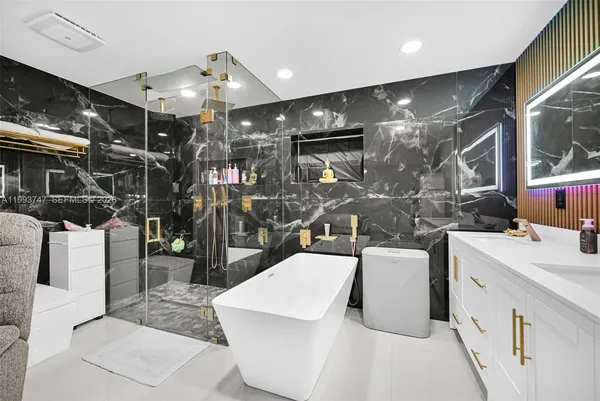 a view of a dining room with furniture and a flat screen tv