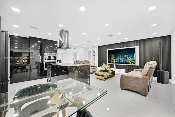 a living room with furniture and a flat screen tv