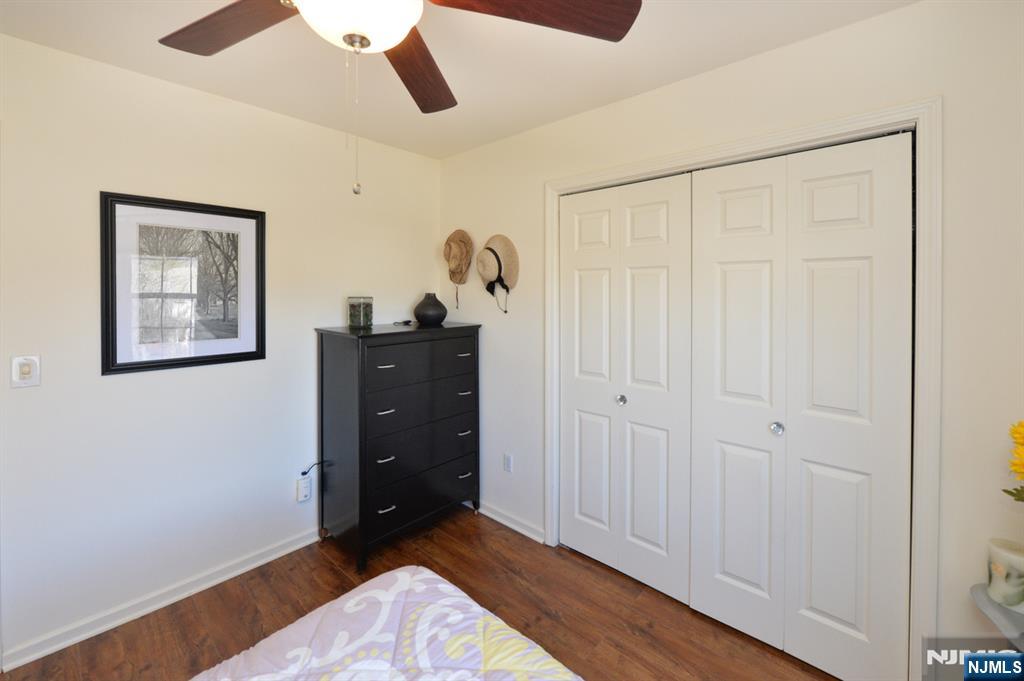 20 Parkside Court Wayne, NJ 07470 - Photo 11 of 22 a view of a bedroom with closet and cabinet