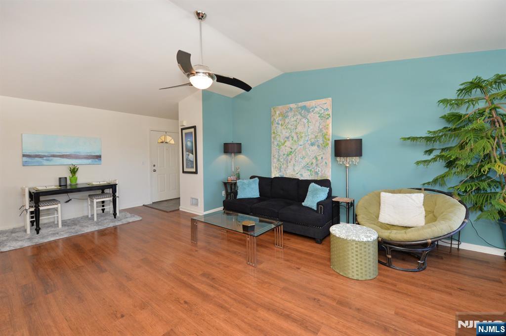 20 Parkside Court Wayne, NJ 07470 - Photo 18 of 22 a living room with furniture a window and a potted plant